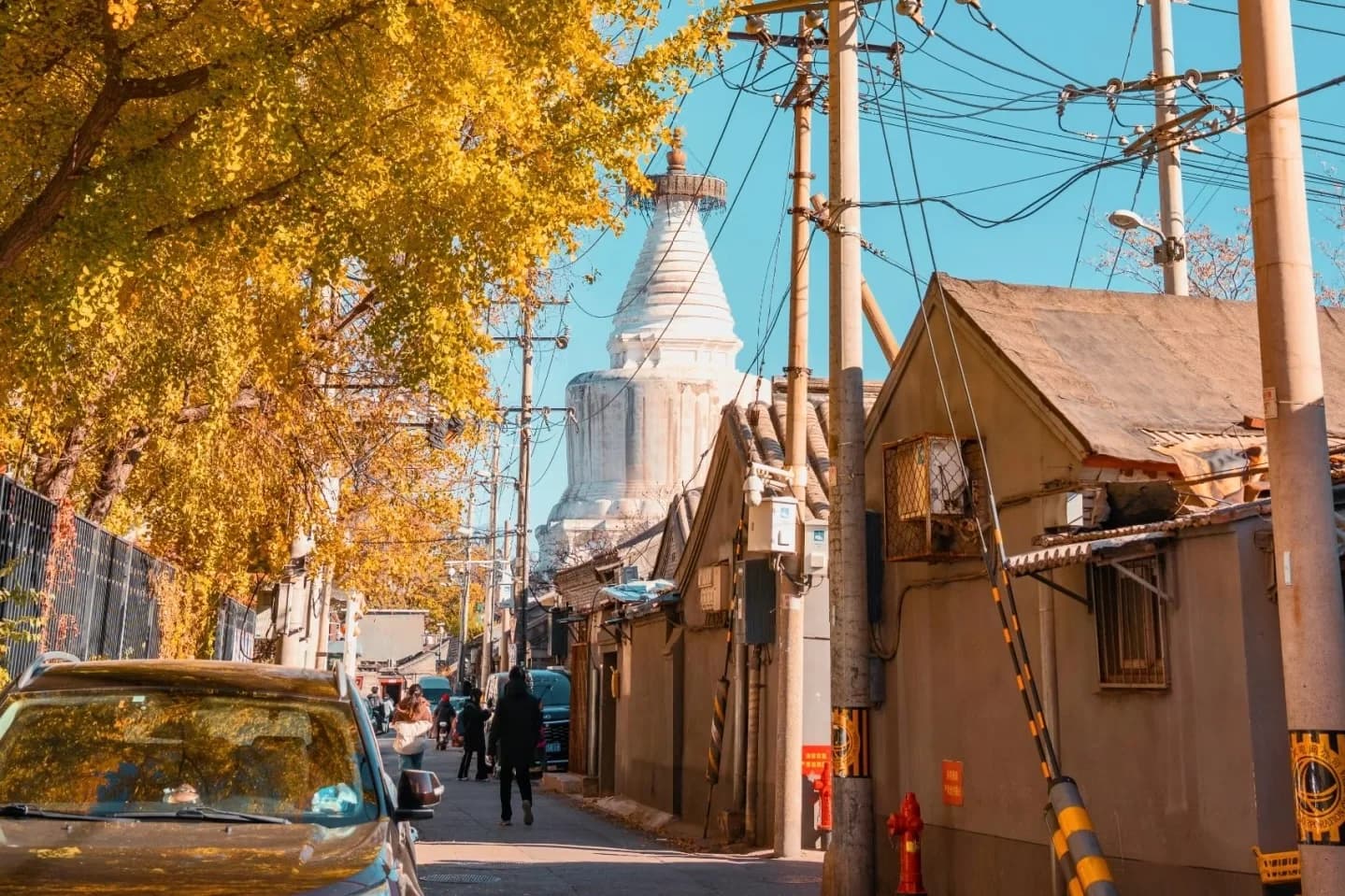 Traditional Beijing hutong alleyway with red lanterns